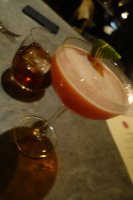 Roasted Cosmo (Grey Goose Le Citron, orange liqueur, roasted bone marrow infusion, cranberry conserve lime) and a Snapper (infused Bombay Sapphire gin, tomato consommé)