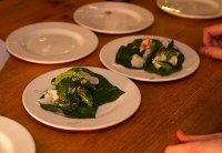 Bai cha plu pla dip - citrus cured brill with som saa and kaffir lime on betel leaf from som saa