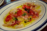 Sea bream carpaccio with squashed datterini tomato and marjoram
