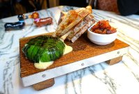 Wood grilled cheese in wild garlic