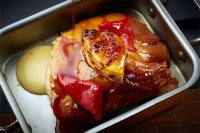 Suckling pig, roasted pineapple with spies, piquillo pepper jus