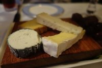 A selection of British cheeses - Beenleigh Blue, Gubbeens, Wealdwad Goats, Somerset brie served with walnut and raisin bread