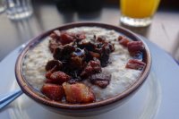 Pinhead porridge with crispy lardons, maple syrup and a month long rum-soaked prune