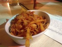 Frites with pulled pork, kimchi and cheese