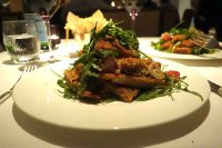 Veal served up with rocket and tomatoes