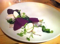 Wild sea bass in dill-vinegar, sea lettuce, purple oxalis leaf, chervil root and celery cress