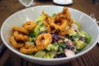 Crispy calamari salad, snap peas, grapes, cashews, ranch dressing from Gander