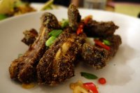 Crispy and aromatic ribs = braised with lemongrass, ginger and lime leaves, with crispy garlic, chilli and spring onions