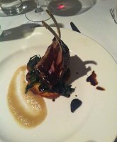 Kerry Hill hoggett cutlets with cavalo nero, poached onion, a potato gallette and black garlic jus