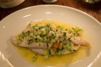 Whole lemon sole with a butter sauce, crab and cucumber