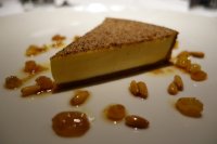 Custard tart with golden sultanas and cobnuts