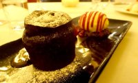 Salted caramel chocolate fondant with raspberry ripple ice cream, chocolate soil