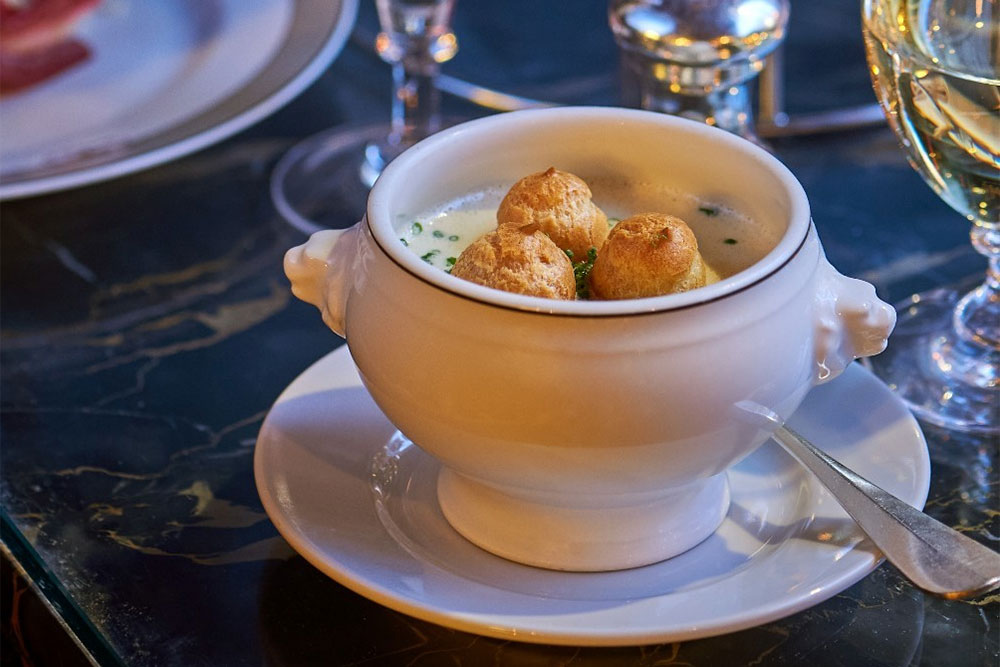 Creamed White Onion Soup with fourme d’ambert choux at The Wolseley